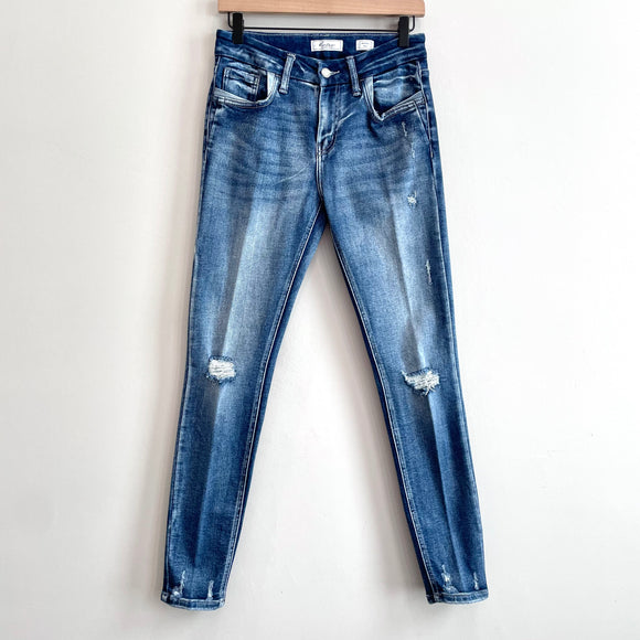 Distressed Mid Rise Skinny Jeans