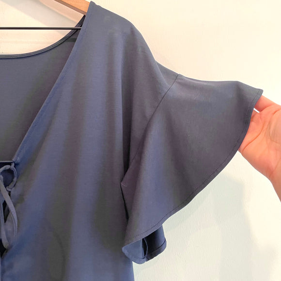 Lace Up Back Peplum Top